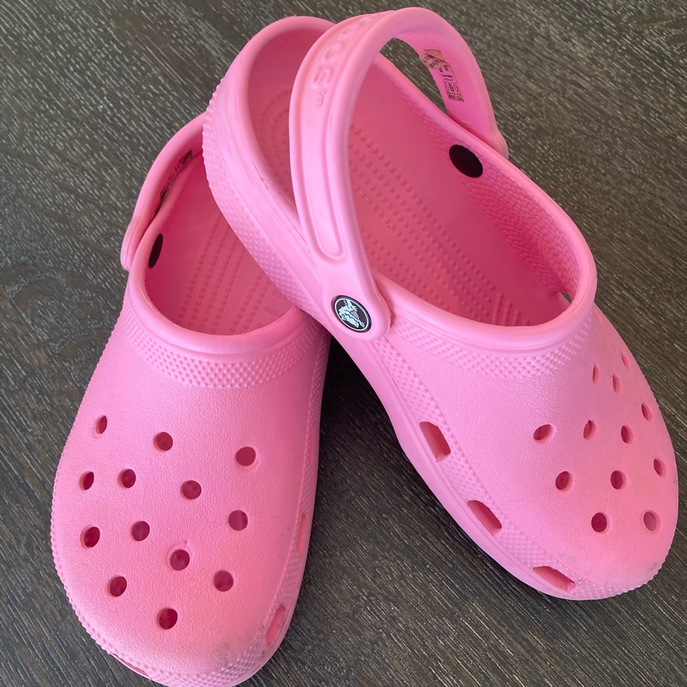 Crocs pink clogs, size 7.